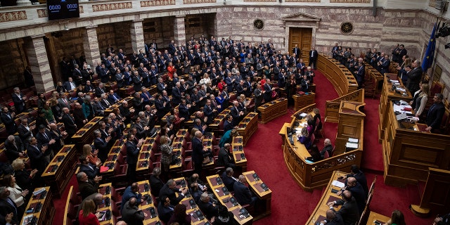 Greek lawmakers applaud during a parliamentary session to vote for the new Greek President, in Athens, on Wednesday, Jan. 22, 2019. High court judge Katerina Sakellaropoulou has been elected at Greece's first female president with an overwhelming majority in a parliamentary vote. (AP Photo/Petros Giannakouris) Greek lawmakers applaud during a parliamentary session to vote for the new Greek President, in Athens, on Wednesday, Jan. 22, 2019. High court judge Katerina Sakellaropoulou has been elected at Greece's first female president with an overwhelming majority in a parliamentary vote. (AP Photo/Petros Giannakouris)