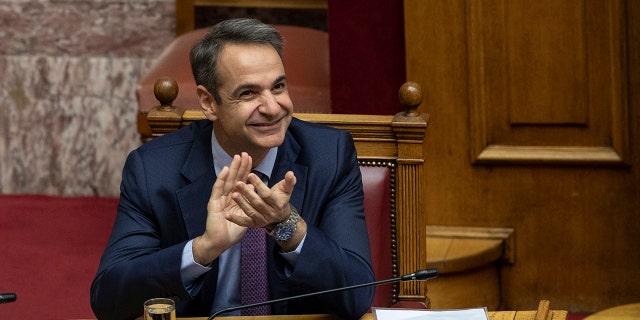 Greek Prime Minister kyriakos Mitsotakis applaud during a parliamentary session to vote for the new Greek President, in Athens, on Wednesday, Jan. 22, 2019. High court judge Katerina Sakellaropoulou has been elected at Greece's first female president with an overwhelming majority in a parliamentary vote. (AP Photo/Petros Giannakouris) Greek Prime Minister kyriakos Mitsotakis applaud during a parliamentary session to vote for the new Greek President, in Athens, on Wednesday, Jan. 22, 2019. High court judge Katerina Sakellaropoulou has been elected at Greece's first female president with an overwhelming majority in a parliamentary vote. (AP Photo/Petros Giannakouris)