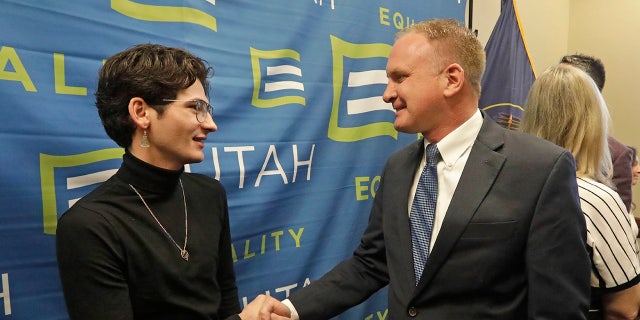 Nathan Dalley, left, shakes hands with Republican Utah Rep. Craig Hall following a news conference about the discredited practice of conversion therapy for LGBTQ children, now banned in Utah Jan. 22 at the Utah State Capitol. Dalley underwent so-called conversion therapy. (AP Photo/Rick Bowmer)