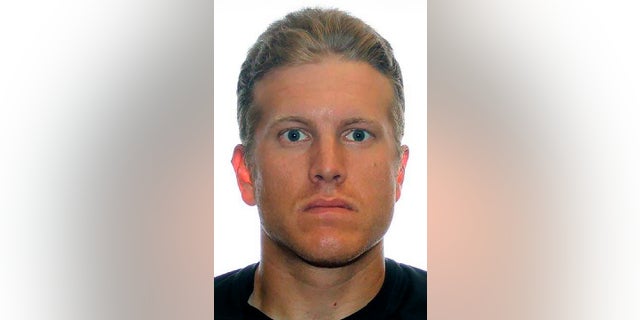 Patrik Mathews, a former Canadian Armed Forces reservist, and two other men who are linked to a violent white supremacist group were believed to be heading to a pro-gun rally in Virginia's capital earlier this week. A federal judge in Maryland ruled Wednesday. that Mathews will remain in custody pending a Jan. 30 preliminary hearing. (Royal Canadian Mounted Police via AP)