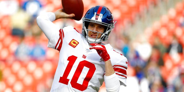 Dec. 22, 2019: New York Giants quarterback Eli Manning works out prior to an NFL football game against the Washington Redskins in Landover, Md. Manning, who led the Giants to two Super Bowls in a 16-year career that saw him set almost every team passing record, has retired. The Giants said Wednesday, Jan. 22, 2020 that Manning would formally announce his retirement on Friday. (AP Photo/Patrick Semansky)