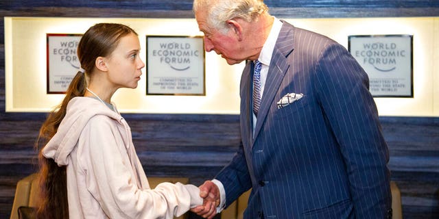 In this photo made available by World Economic Forum, Britain's Prince Charles meets climate activist Greta Thunberg after he delivered a speech at the World Economic Forum in Davos, Switzerland, Wednesday, Jan. 22.