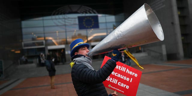 Anti-Brexit campaigner Steve Bray reacts to the photographer after a protest outside the European Parliament in Brussels.