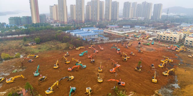 Heavy equipment at a construction site for a field hospital in Wuhan in central China's Hubei Province. 