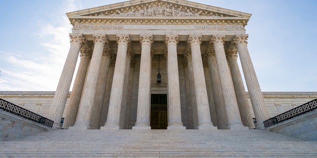The Supreme Court is putting off the oral arguments scheduled for its March session, but will still be open for business. This is the first time the court has postponed its oral arguments since the 1918 Spanish flu outbreak. (AP Photo/J. Scott Applewhite)