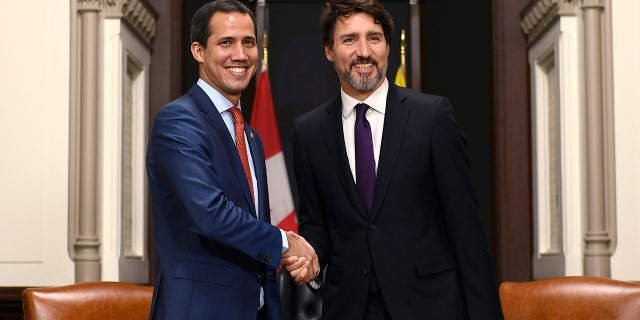Canada's Prime Minister Justin Trudeau, right, and interim President of Venezuela Juan Guaido shake hands before a meeting at Trudeau's Parliament Hill office in Ottawa, Ontario, Monday, Jan. 27, 2020. (Justin Tang/The Canadian Press via AP)