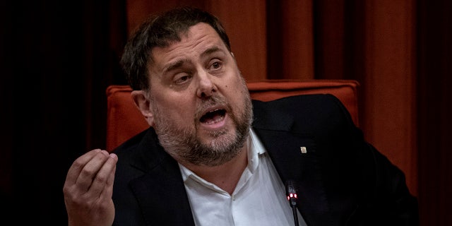 Catalonia's ex-regional vice-president Oriol Junqueras speaks at the Parliament of Catalonia in Barcelona, Spain, Tuesday, Jan. 28, 2020. Six former members of Catalonia's regional government have been escorted from prison to attend a hearing at the regional parliament in Barcelona. (AP Photo/Emilio Morenatti)