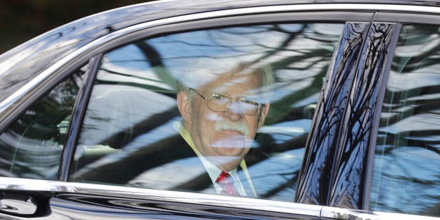 Former National security adviser John Bolton leaves his home in Bethesda, Md. Tuesday, Jan. 28, 2020. President Donald Trump's legal team is raising a broad-based attack on the impeachment case against him even as it mostly brushes past allegations in a new book that could undercut a key defense argument at the Senate trial. Former national security adviser John Bolton writes in a manuscript that Trump wanted to withhold military aid from Ukraine until it committed to helping with investigations into Democratic rival Joe Biden. (AP Photo/Luis M. Alvarez)