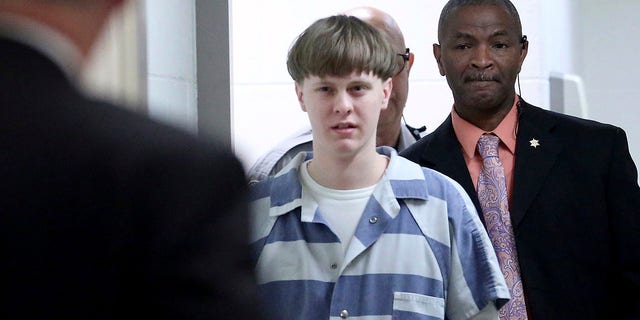 In this  2017, file photo, Dylann Roof enters the court room at the Charleston County Judicial Center to enter his guilty plea on murder charges in Charleston, S.C. 