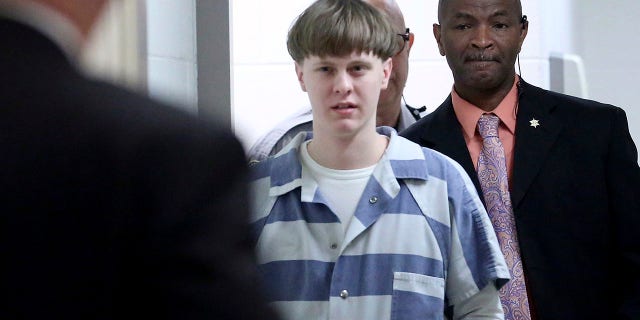 In this 2017, file photo, Dylann Roof enters the court room at the Charleston County Judicial Center to enter his guilty plea on murder charges in Charleston, S.C.