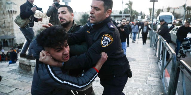 Israeli border police arrests a Palestinian ahead of a protest against Middle East peace plan announced Tuesday by US President Donald Trump, which strongly favors Israel, in Jerusalem, Wednesday, Jan 29, 2020.