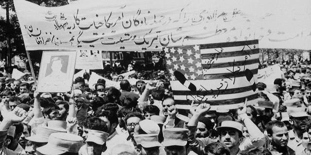 About ten thousand Iranians attend a 'Death to America' rally that was also the funeral for 72 of the 290 passengers and crew members killed aboard Iranian Air Flight 655 in 1988.