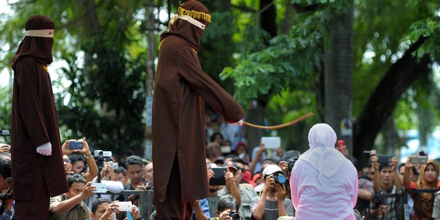 Men and women can face floggings for a range of offenses, including gambling, drinking alcohol, homosexuality and extramarital sex. (CHAIDEER MAHYUDDIN/AFP via Getty Images)