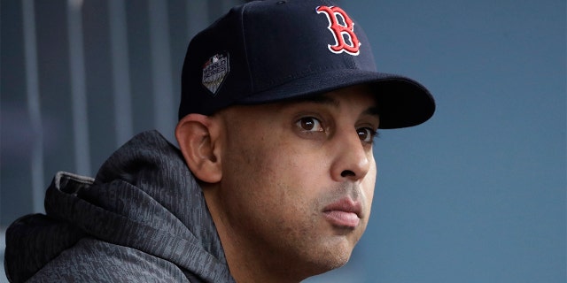FILE - In this Oct. 28, 2018, file photo, Boston Red Sox manager Alex Cora waits for the start of Game 5 of the baseball World Series between the Red Sox and Los Angeles Dodgers in Los Angeles. (AP Photo/David J. Phillip, File)