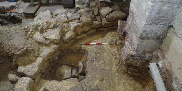 The ancient stone structures were uncovered beneath Bath Abbey in southern England.