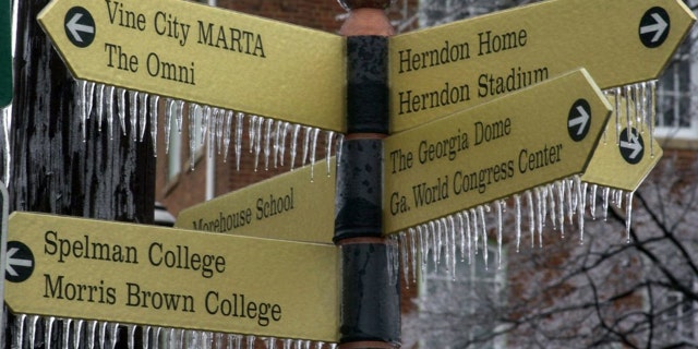 In this Jan. 23, 2000, file photo, ice forms on a street sign following an overnight ice storm in Atlanta.