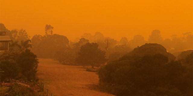 The sky glows orange as surrounding wildfires close in on the town of Mallacoota, Victoria, Australia, January 4, 2020, in this photo obtained from social media.