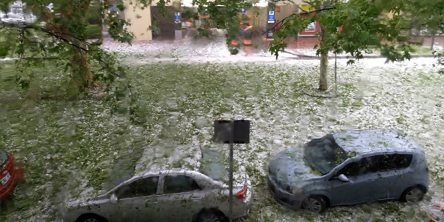 Dust storms, hail and flash floods have battered beleaguered Australian cities in recent days.