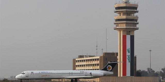 A Caspian Airlines plane lands at Baghdad International airport.