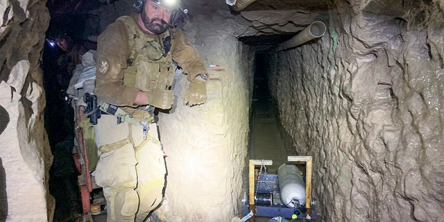 A tunnel entry team agent stands by for security at a tunnel spur that went off into a different direction.