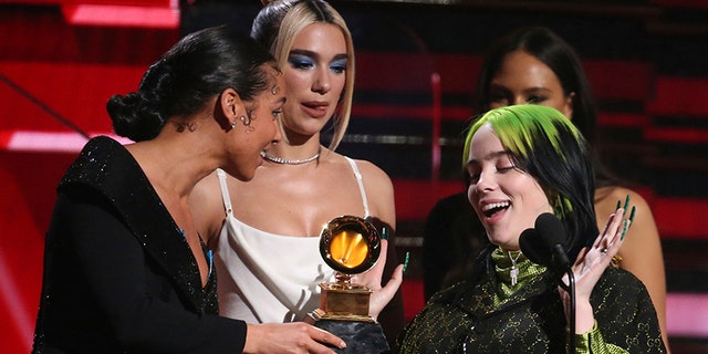 Alicia Keys, from left, and Dua Lipa present Billie Eilish with the award for best new artist at the 62nd annual Grammy Awards on Sunday, Jan. 26, 2020, in Los Angeles. (Photo by Matt Sayles/Invision/AP)