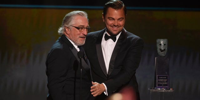 Leonardo DiCaprio, right, presents the lifetime achievement award to Robert De Niro at the 26th annual Screen Actors Guild Awards at the Shrine Auditorium & Expo Hall on Sunday, Jan. 19, 2020, in Los Angeles.