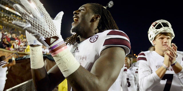 Mississippi State wide receiver De'Runnya Wilson, left, and quarterback Nick Fitzgerald, right, celebrate with the rest of their team after defeating Missouri 31-13 in an NCAA college football game in Columbia, Mo. in 2015. (AP Photo/L.G Patterson, File)