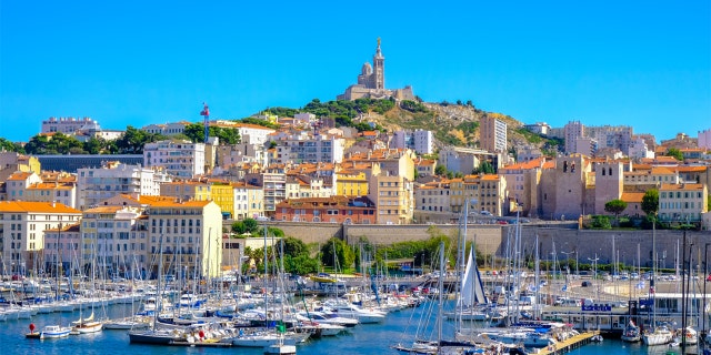 Marseille embankment with yachts and boats in the Old Port and Notre Dame de la Garde., Vieux-Port de Marseille.