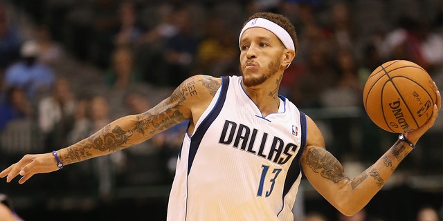 Delonte West #13 of the Dallas Mavericks passes the ball against the Phoenix Suns during a preseason game at American Airlines Center on October 17, 2012 in Dallas, Texas.