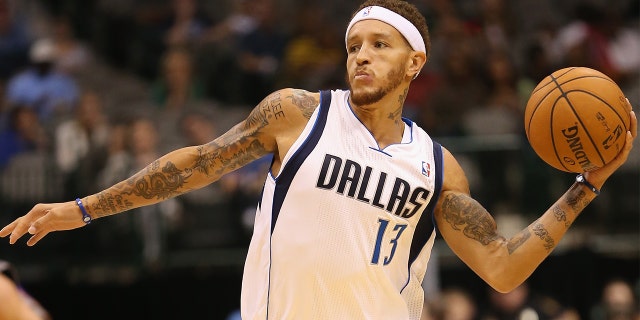 Delonte West #13 of the Dallas Mavericks passes the ball against the Phoenix Suns during a preseason game at American Airlines Center on October 17, 2012 in Dallas, Texas.