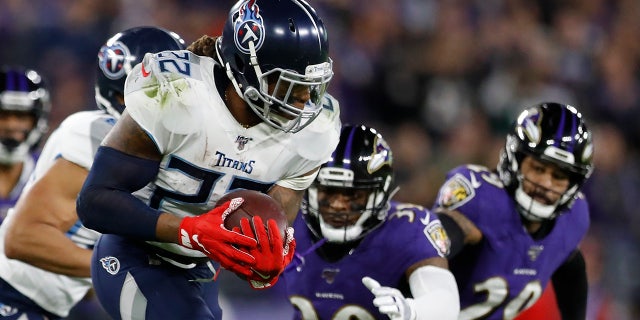 Tennessee Titans running back Derrick Henry (22) runs against the Baltimore Ravens during the first half an NFL divisional playoff football game, Saturday, Jan. 11, 2020, in Baltimore. (AP Photo/Julio Cortez)