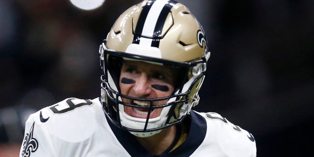 New Orleans Saints quarterback Drew Brees (9) celebrates a touchdown carry by Alvin Kamara in the first half of an NFL wild-card playoff football game against the Minnesota Vikings, Sunday, Jan. 5, 2020, in New Orleans. (AP Photo/Butch Dill)