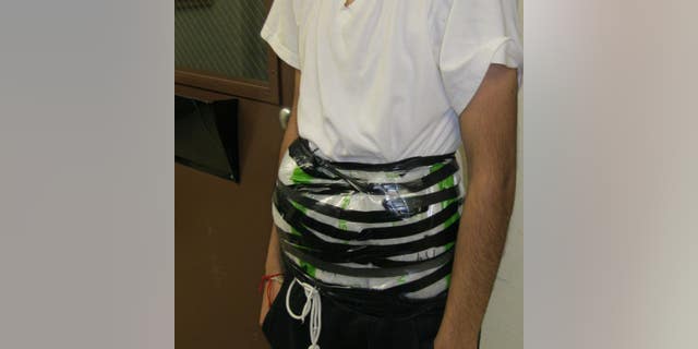 A 14-year-old boy was caught at the U.S.-Mexico border with crystal methamphetamine strapped to his waist Monday night, authorities said.