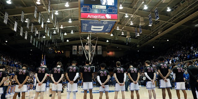 Duke players wear a Number 24 jersey during a moment of silence in memory of Kobe Bryant and his daughter Gianna Bryant prior to an NCAA college basketball game against Pittsburgh in Durham, N.C., Tuesday, Jan. 28, 2020. (AP Photo/Gerry Broome)