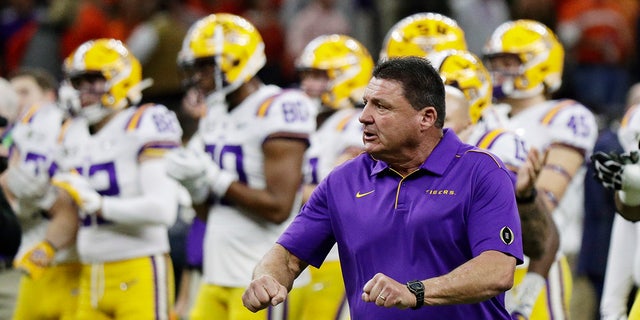 LSU head coach Ed Orgeron watches during warm ups before a NCAA College Football Playoff national championship game against Clemson Monday, Jan. 13, 2020, in New Orleans. (AP Photo/Sue Ogrocki)