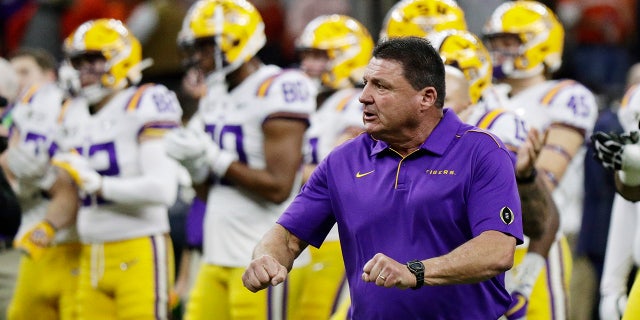 LSU head coach Ed Orgeron watches during warm ups before a NCAA College Football Playoff national championship game against Clemson Monday, Jan. 13, 2020, in New Orleans. (AP Photo/Sue Ogrocki)