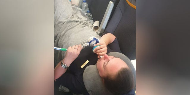 Garrity was forced to wait seven hours before the plane landed and she could be taken to the hospital.