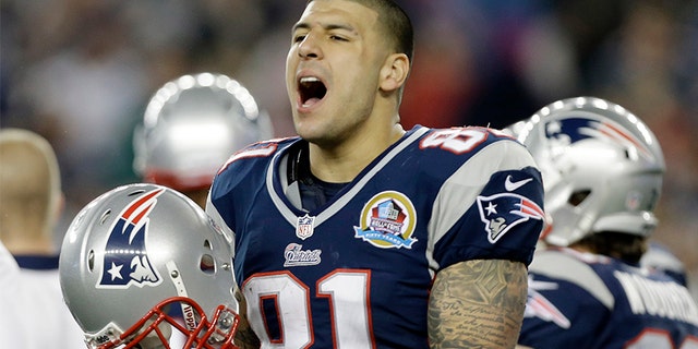 Dec. 10, 2012: New England Patriots tight end Aaron Hernandez reacts during the second quarter of an NFL football game against the Houston Texans in Foxborough, Mass. State and local police spent hours at the home of New England Patriots tight end Aaron Hernandez on Tuesday June 18, 2013 as another group of officers searched an industrial park about a mile away where a body was discovered the day before. (AP Photo/Elise Amendola)