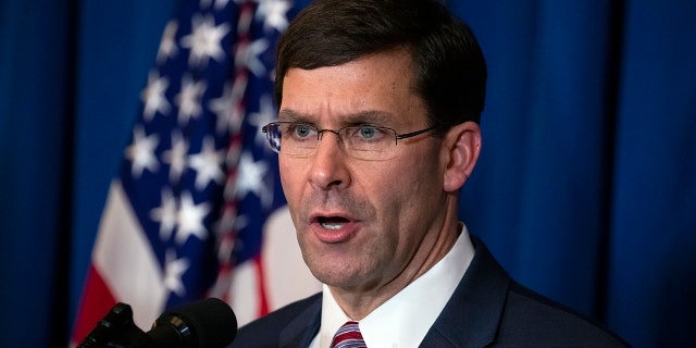 Secretary of Defense Mark Esper delivers a statement on Iraq and Syria, at President Donald Trump's Mar-a-Lago property, Sunday, Dec. 29, 2019, in Palm Beach, Fla. (AP Photo/ Evan Vucci)