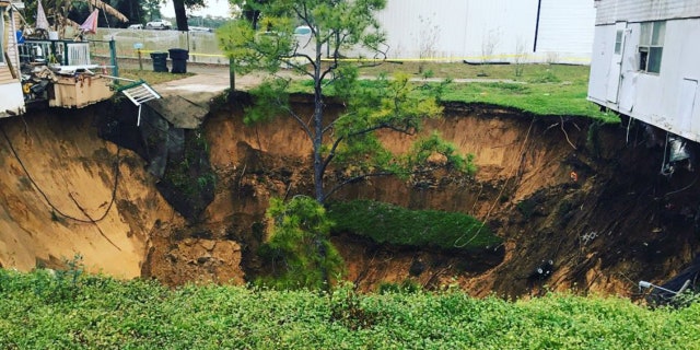 The sinkhole opened up around 5:30 p.m. on Tuesday in the mobile home park.