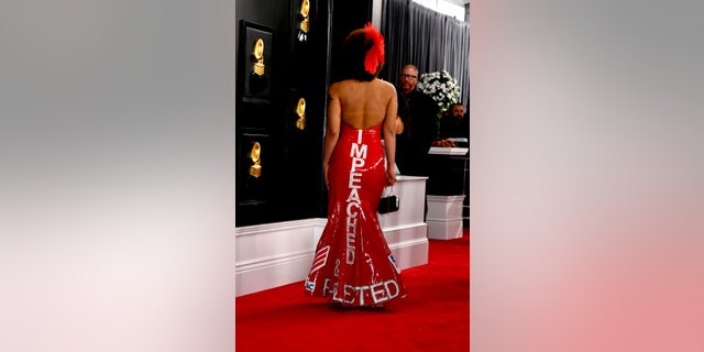 The back of Joy Villa's red gown spelled out "IMPEACHED" and "RE-ELECTED" at the Grammy Awards on Sunday.