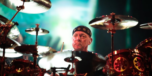 Neil Peart of Rush performs on stage at O2 Arena on May 24, 2013 in London, England. (Photo by Christie Goodwin/Redferns via Getty Images)