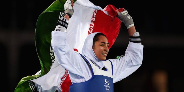 Kimia Alizadeh Zenoorin of Iran celebrates after defeating Nikita Glasnovic of Sweden during a women's Bronze Medal Taekwondo contest at the 2016 Summer Olympics, Aug. 18, 2016 in Rio de Janeiro, Brazil. (Getty Images)