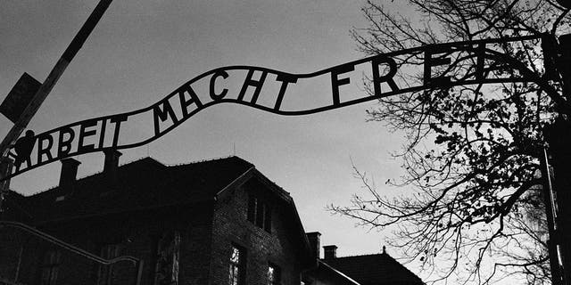 The main entrance at the former Nazi death camp of Auschwitz in Oswiecim, Poland, with the inscription, 'Arbeit Macht Frei', which translates into English as '