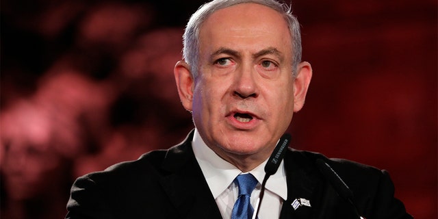 Israeli Prime Minister Benjamin Netanyahu speaks during the Fifth World Holocaust Forum at the Yad Vashem Holocaust memorial museum in Jerusalem, Israel, Thursday. (Abir Sultan, Pool via AP)