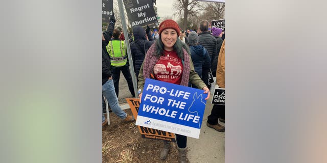 Kristin Vail, 26, holding a Democrats for Life sign outside of the Supreme Court at the 2020 March for Life