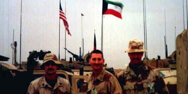Hannel (center) with fellow Marines during Desert Storm as they moved north. (Courtesy of Eric Hannel)