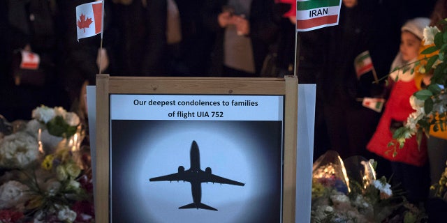 Mourners attend a memorial, Tuesday, Jan. 14, 2020, in North Vancouver, British Columbia, to remember Canadian victims in the deadly downing of a Ukrainian airliner the week before, in Iran. (Jonathan Hayward/The Canadian Press via AP)