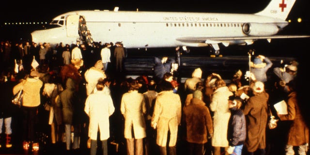 The first of the 52 American hostages freed from Iran, leave a U.S. Airforce hospital plane after its arrival at Rhein-Main Air Base, near Frankfurt, Germany, January 21, 1981. (AP Photo/Str)
