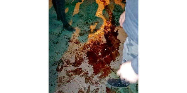 This Sunday, Jan. 12, 2020, photo provided by the New York-based Center for Human Rights in Iran, shows a pool of blood near Azadi, or Freedom, Square after police broke up a demonstration in Tehran, Iran. (Center for Human Rights in Iran via AP)